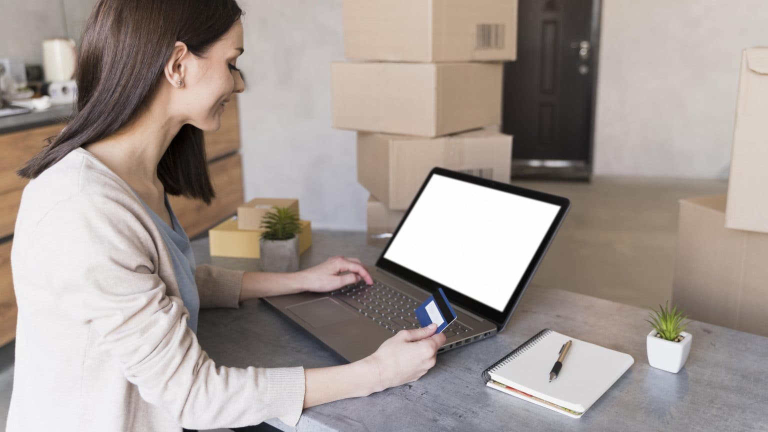 Woman at a desk booking a courier pickup online
